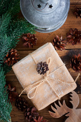 Christmas present on a wooden table, top view, selective focus