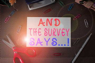 Writing note showing And The Survey Says. Business concept for written spoken results of short quiz...