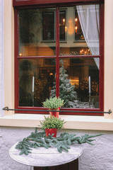 Decorated table in front of the window for Christmas