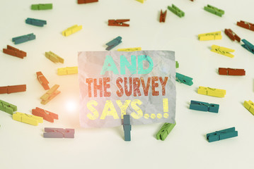 Writing note showing And The Survey Says. Business concept for written spoken results of short quiz...