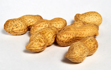 Dried roasted peanuts in closeup. Organic vegan food