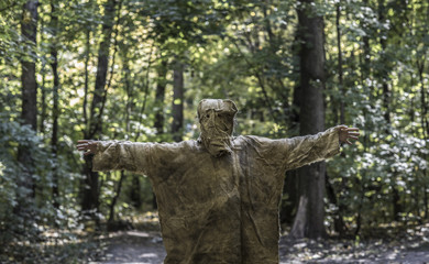Fototapeta na wymiar scary man in burlap in the forest