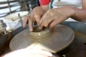 Person sculpts bowl