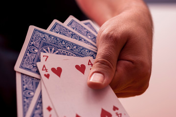  A hand holding poker cards