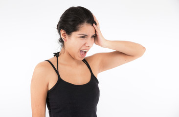 Fototapeta premium Anger of an emotional girl on a light background