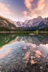 Mountains Reflection in Clear Fusine Lake Water at Beautiful Sunset