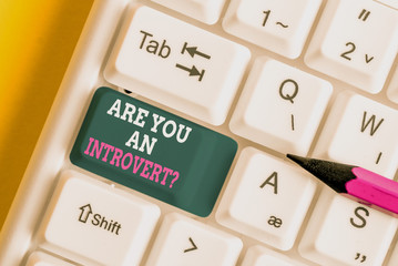 Writing note showing Are You An Introvertquestion. Business concept for demonstrating who tends to...