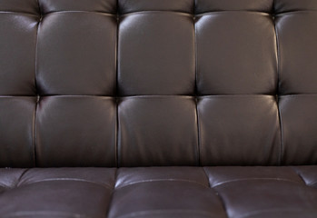 Naklejka na ściany i meble Glossy black sofa surface into a table