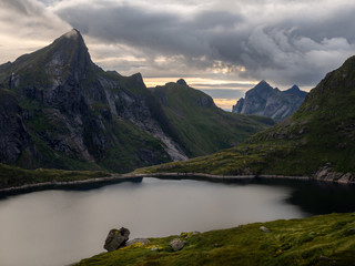 A mountain lake surrounded by peaks in the Norwegian area of Lofoten
