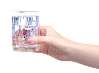 Glass of water with ice in hand on white background isolation