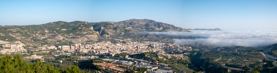 panoramic of Spanish village with mists