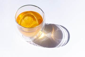 Glass of green tea with lemon and ginger close up