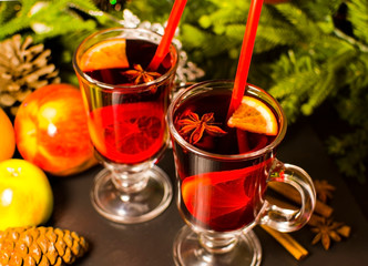 Christmas hot drink mulled wine with orange and cinnamon. Holiday decor. Selective focus.