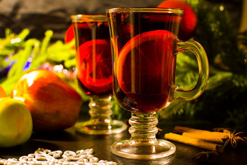 Christmas hot drink mulled wine with orange and cinnamon. Holiday decor. Selective focus.
