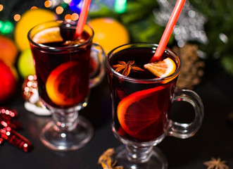 Christmas hot drink mulled wine with orange and cinnamon. Holiday decor. Selective focus.