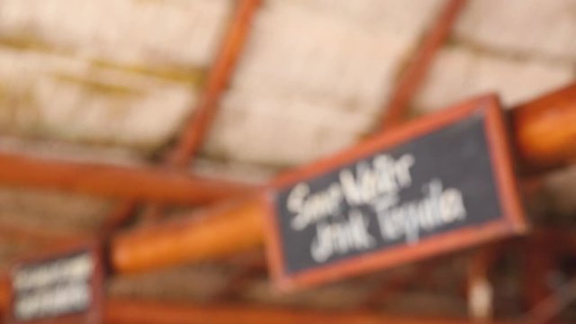 "Save water - Drink tequila" sign at a bar