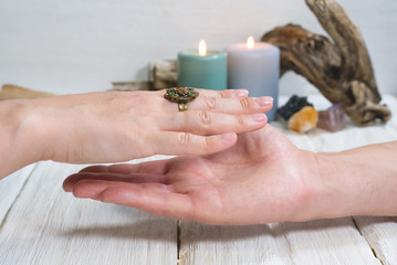 Fortune teller reading future by the hand. Palmistry.