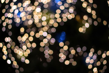 Beautiful Christmas background with garlands and bokeh. New year  multi-colored picture. Abstract photo image for design