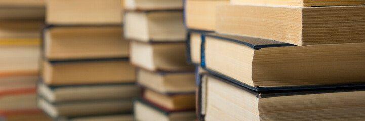 Stack of books background. many books piles.