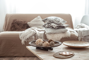 Cozy bright living room with sofa and pillows.