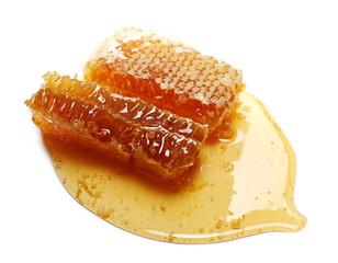 Honey and honeycomb isolated on white background