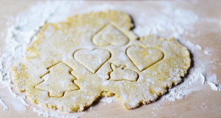 the dough for the shortbread in a heart shape on cutting Board