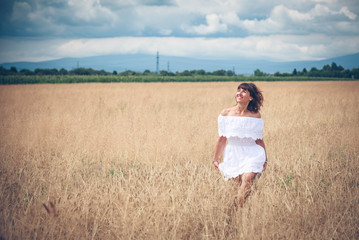 Happy woman on wheat field