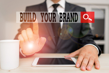 Conceptual hand writing showing Build Your Brand. Concept meaning enhancing brand equity using...