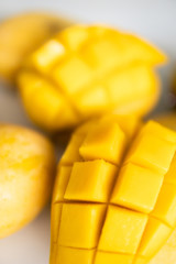 Mango cubes Macro, slices close up isolated on white.