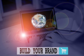 Text sign showing Build Your Brand. Business photo text enhancing brand equity using advertising campaigns Picture photo system network scheme modern technology smart device and Elements of this image