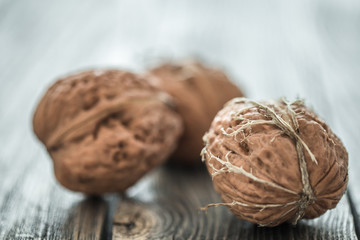 Walnut lies on a wooden background , close-up .