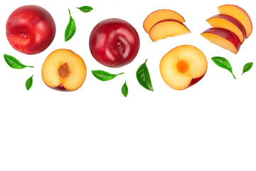fresh red plum and half with leaves isolated on white background with copy space for your text. Top view. Flat lay