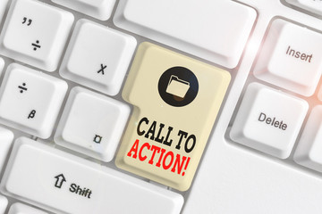 Text sign showing Call To Action. Business photo showcasing exhortation do something in order achieve aim with problem White pc keyboard with empty note paper above white background key copy space