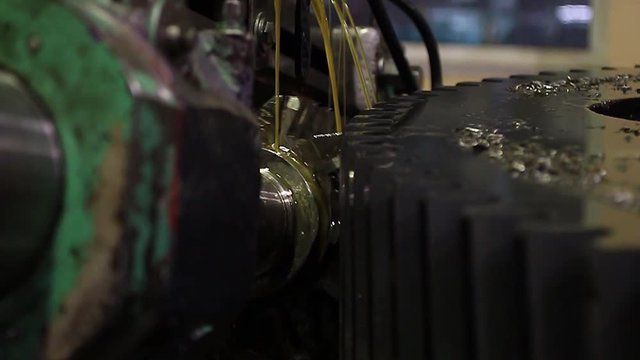 On a hobbing machine, cutting involute teeth with a worm cutter, on a steel crown with the use of oil as a cooling liquid.