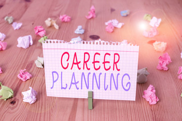 Text sign showing Career Planning. Business photo text Strategically plan your career goals and work success Colored crumpled papers empty reminder wooden floor background clothespin