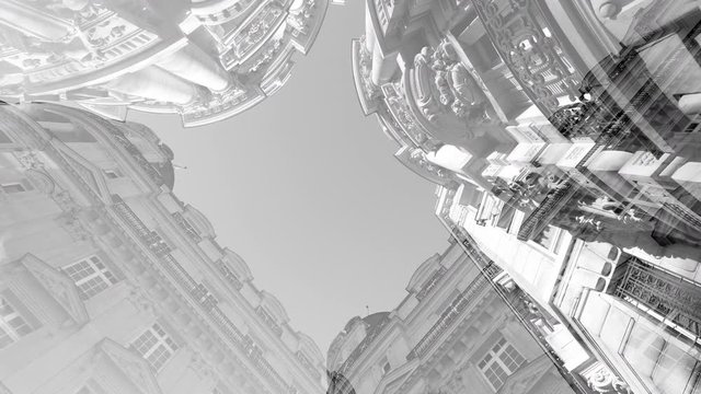 Black and white 4K UHD footage low angle view abstract composite inception footage of Parisian architecture buildings with clear blue sky