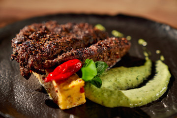 Delicious steak with spinach sauce.