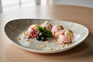 Four scoops of berry ice cream.