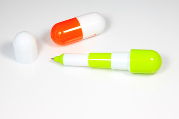 Drug capsules and ballpoint pen
