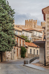 Old buildigs and fortification walls of the old town in Avila, Spain.