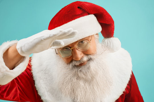 Traditional Santa Claus in glasses with grey beard in studio