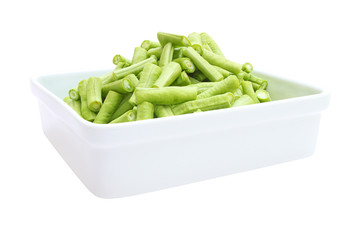 Side of Fresh chop green yard long bean in bowl on white background.