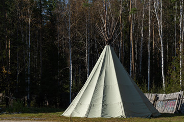 Native American wigwam in the forest. Modern material for the manufacture of wigwam. Yurt is the home of the northern peoples. © woff