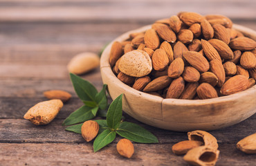 Fresh almonds in the wooden bowl