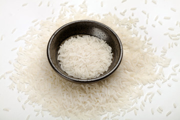 white rice in a plate on a white table