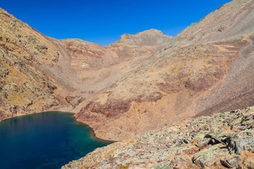 Fototapeta na wymiar Estany Negre (Black Lake) in Parc Natural Comunal de les Valls del Comapedrosa national park in Andorra