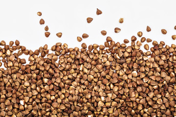 background of buckwheat grains on a white table
