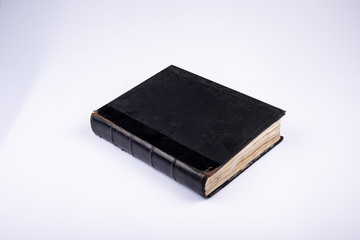 Old Classic Black Book on White Background