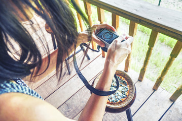 Tourists taking pictures of pizza