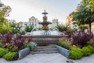 Fototapeta na wymiar Fountain at Plaza Navarra square in Huesca, Spain.
